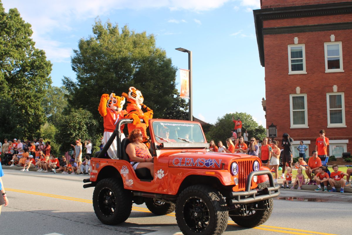 The Tiger and the Tiger Cub ride along for the Annual First Friday Parade—a Clemson tradition dating back to 1974.