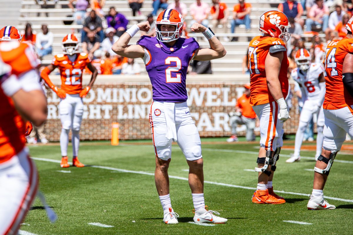 Klubnik calls a play during Clemson's spring game back in April as freshman receiver Bryant Wesco Jr. (12) watches for the signal. 