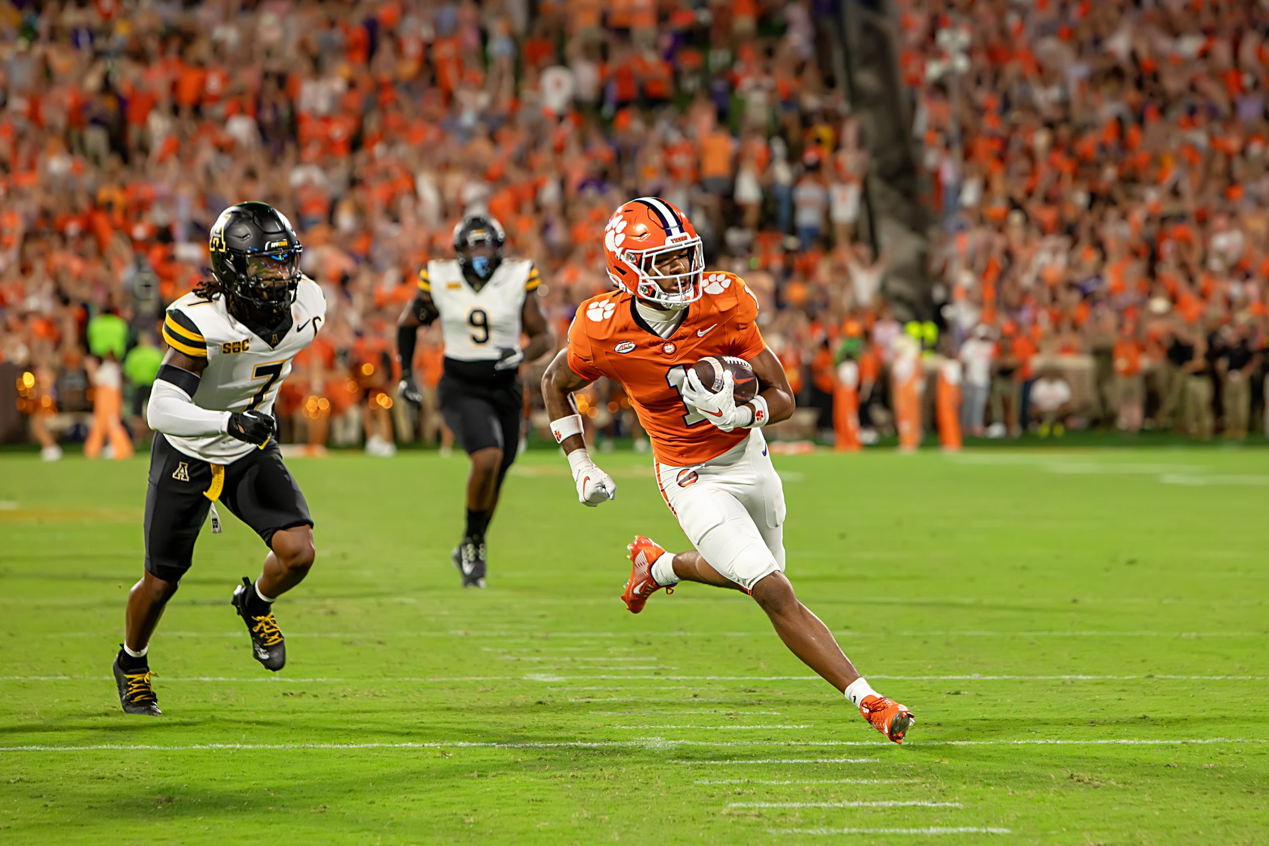 Receiver T.J. Moore credits his strong relationship with Coach Swinney as the reason he chose Clemson - not the money thrown at him by other programs. 