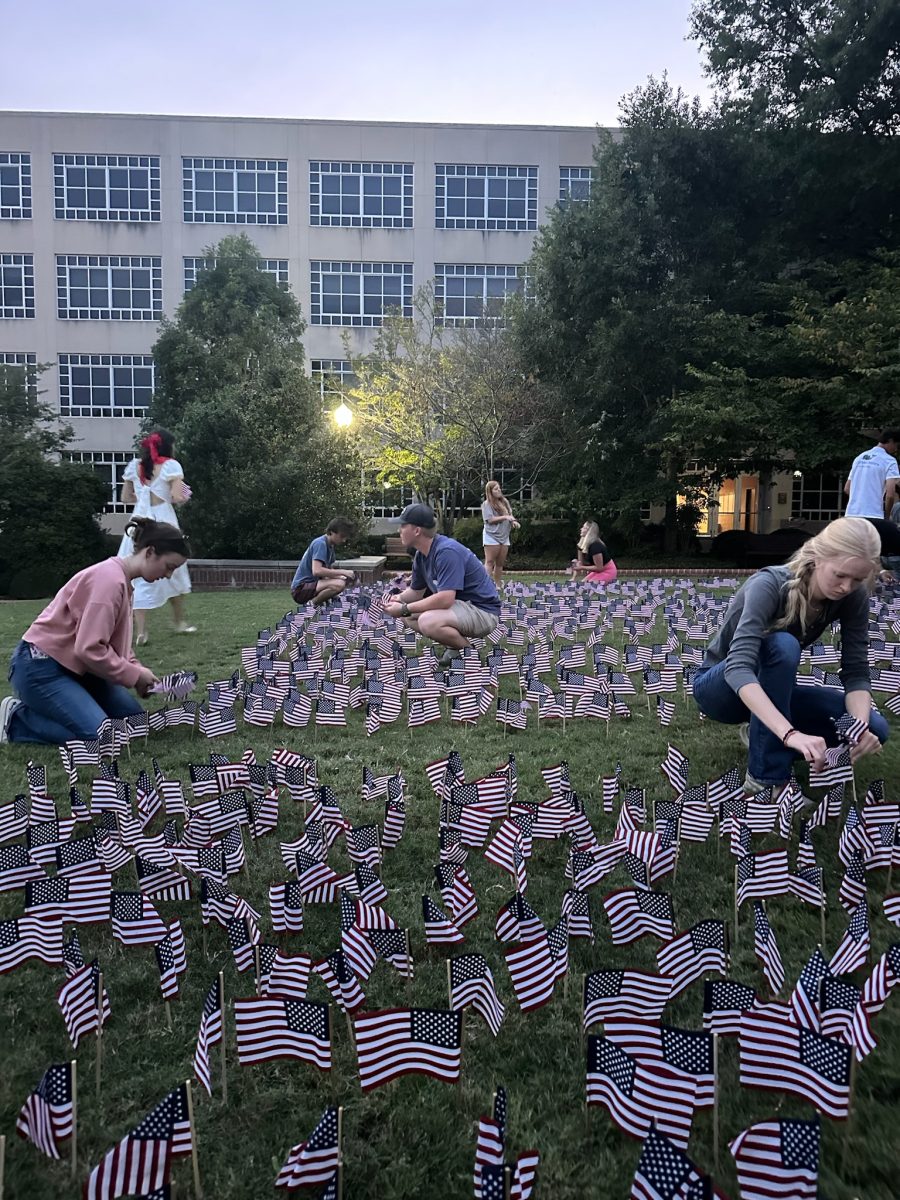 YAF members set up American flags on North Green.