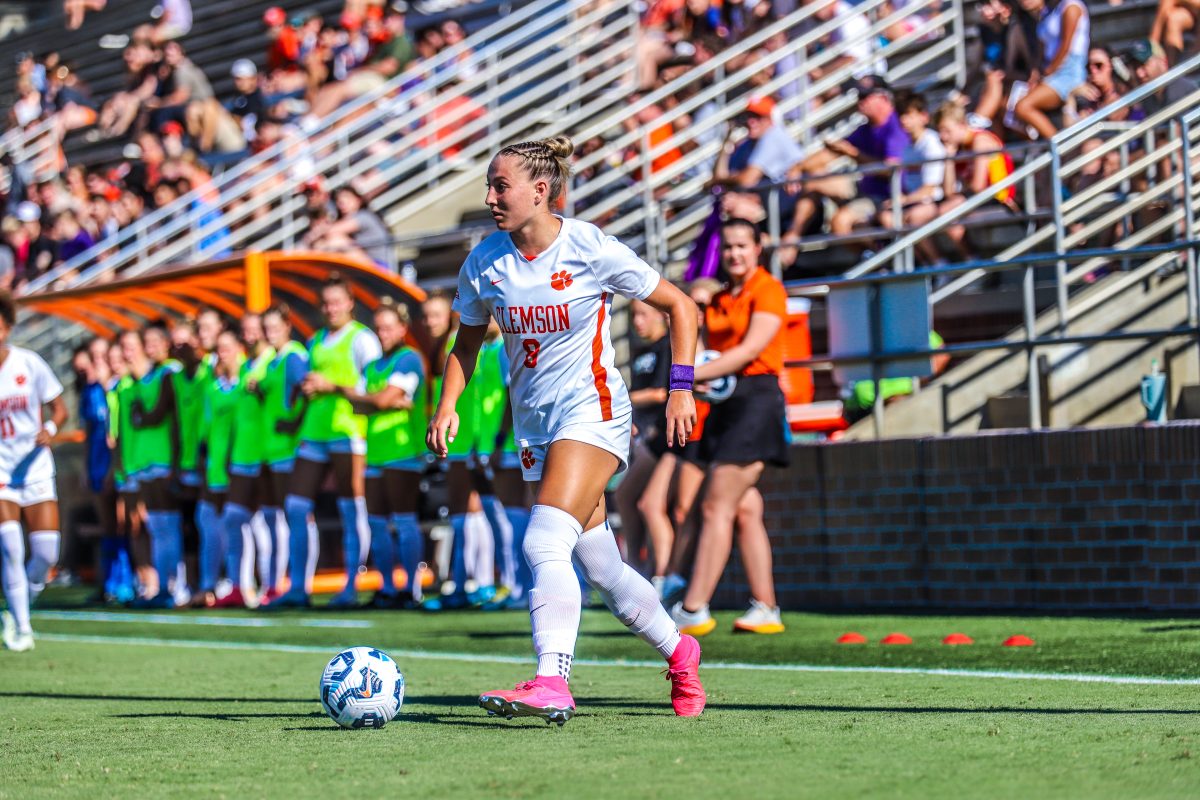 Forward Jenna Tobia (8) dribbles the ball towards the net during Clemson's match against High Point.