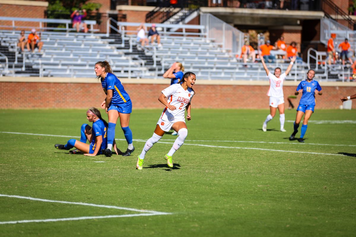 Makenna Morris (2), now of the Washington Spirit, celebrates last November with former teammate Caroline Conti, now of Bay FC, in the background.