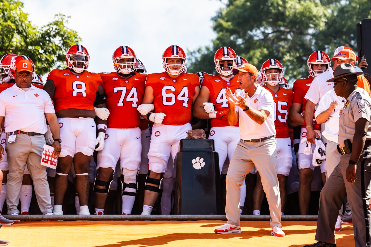 Dabo hypes the team up as they prepare for the most exciting 25 seconds in college football — running down the hill.