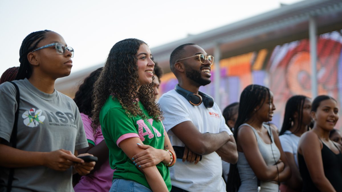 Students enjoying the Gantt Center's Grill and Greet in front of Watt Innovation Center event on August 22.