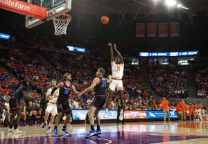 Clemson forward Chauncey Wiggins pulls up for a mid-range shot over defenders in the Tigers' 85-68 win over Boise State on Nov. 19, 2023.