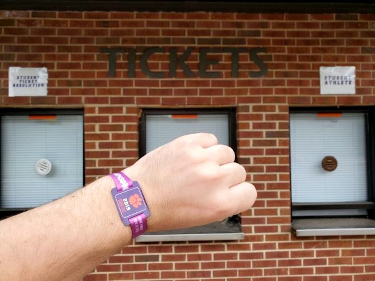 Clemson students use wristbands for student tickets, with the color differentiating where one sits during the game. 