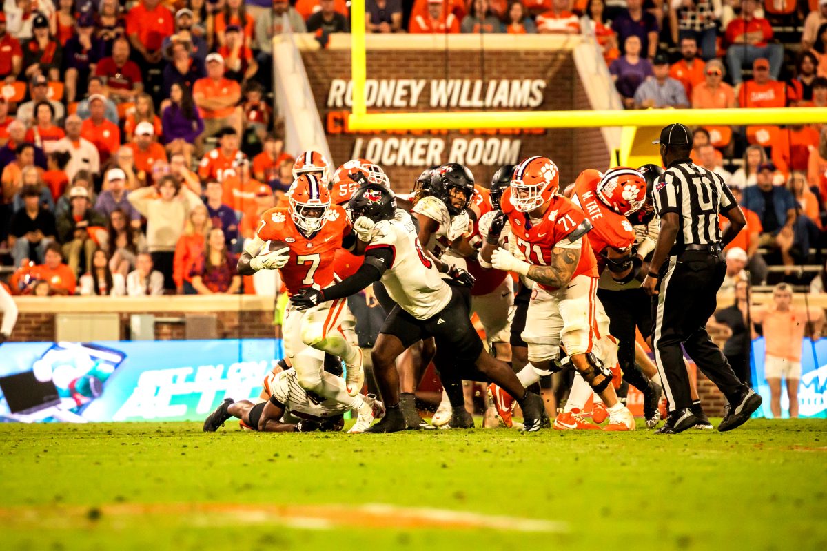 Clemson running back Phil Mafah (7) attempts to brind down a Louisville defender in the Tigers' loss to the Cardinals on Nov. 2.