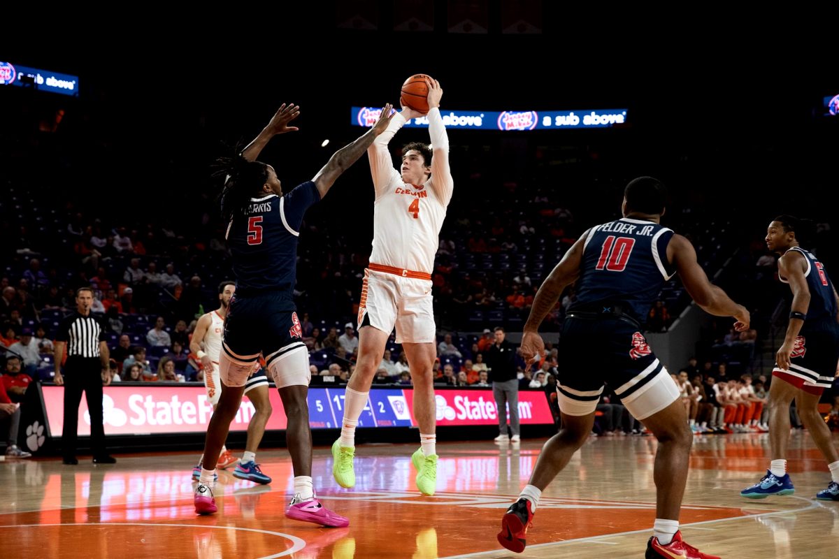 Clemson forward Ian Schieffelin (4) attempts a shot over a defender in the Tigers' win over Radford on Nov. 21 at Littlejohn Coliseum. 