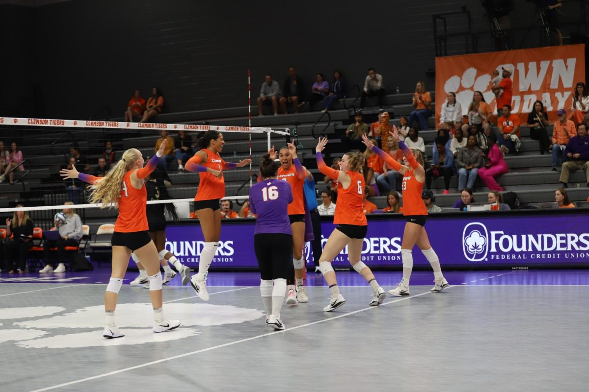 Clemson volleyball celebrates after winning the point against Wake Forest. 