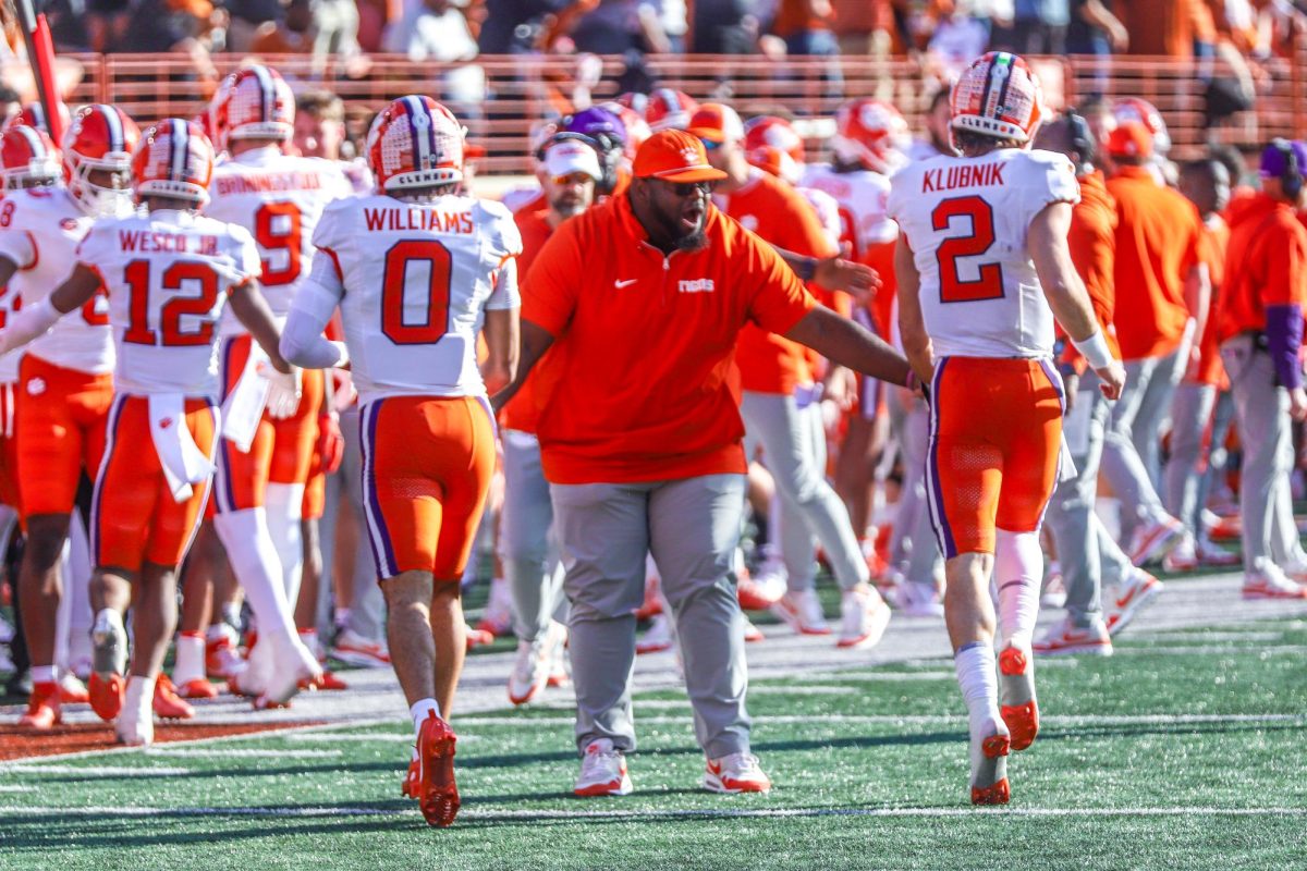 Quarterback Cade Klubnik (right) and wide receiver Antonio Williams (left) celebrate as the come off the field following a touchdown during Clemson's matchup against Texas in the first round of the College Football Playoff in Austin, Texas, on Dec. 21, 2024.