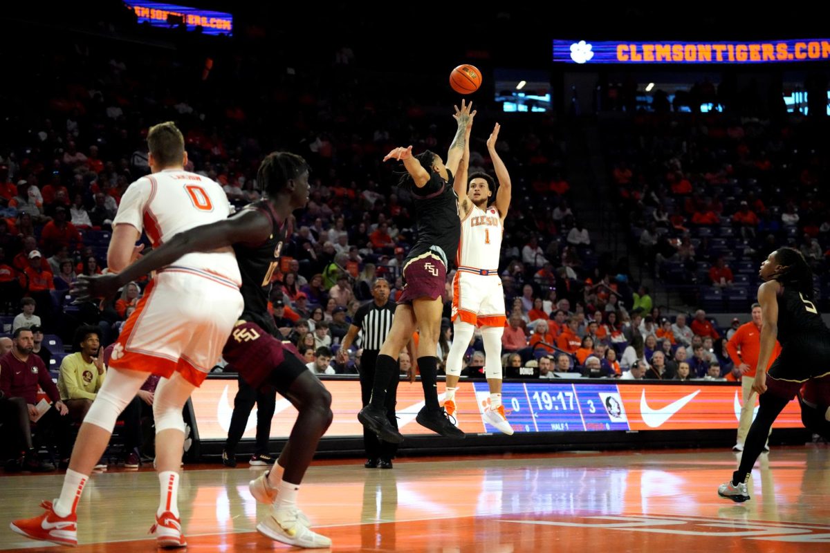 Clemson guard Chase Hunter (1) attempts a shot over a Florida State defender in the Tigers' win over the Seminoles on Jan. 11 at Littlejohn Coliseum. 