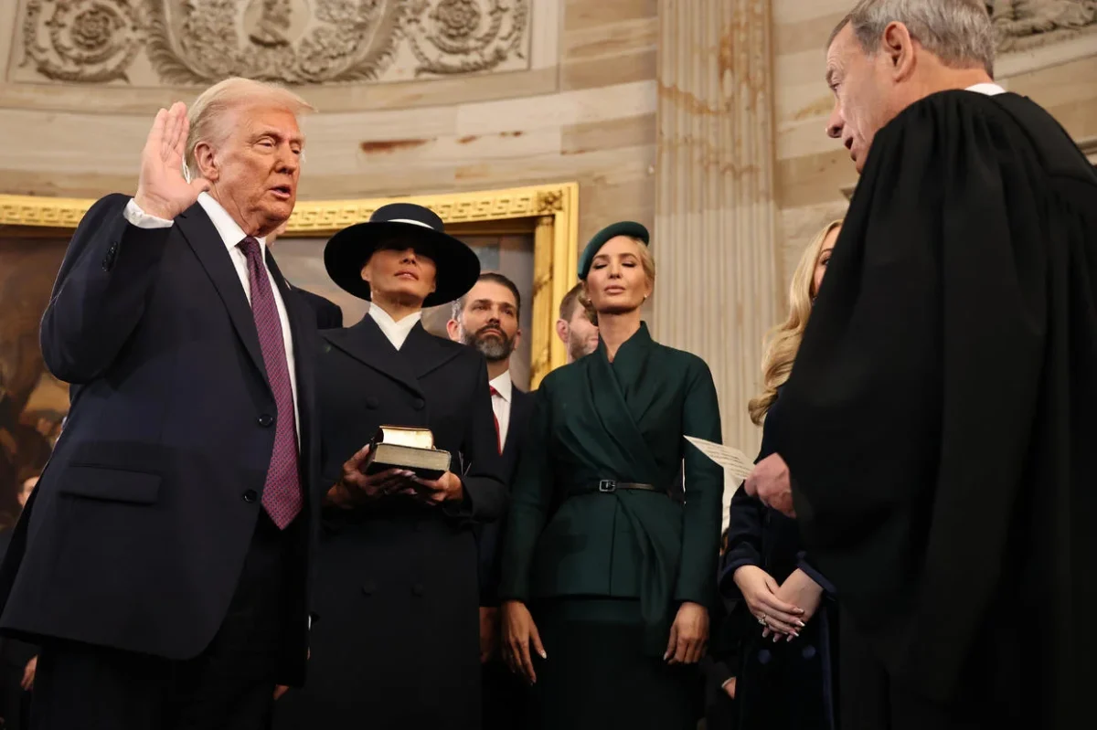 United States Supreme Court Chief Justice John Roberts leads President Donald Trump through the presidential oath of office alongside first lady Melania Trump.