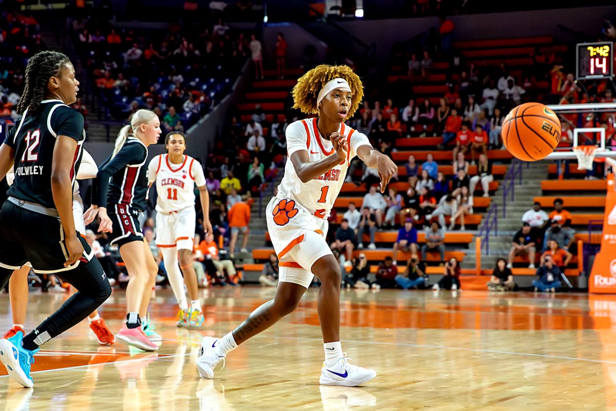 Clemson guard Loyal McQueen (1) sends a pass in the Tigers' game against South Carolina at Littlejohn Coliseum on Nov. 20, 2024.