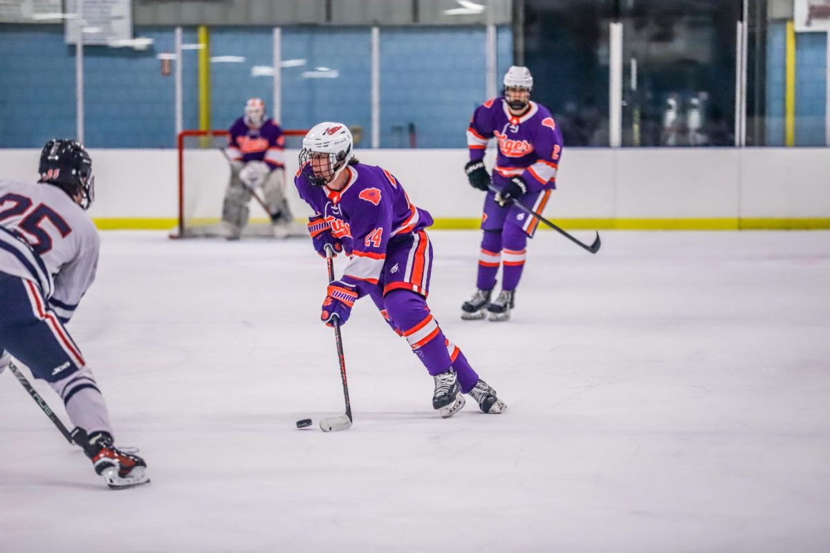 Ethan Callahan (24) skates the puck into the offensive zone during Clemson's game against Ole Miss on Feb. 1. 