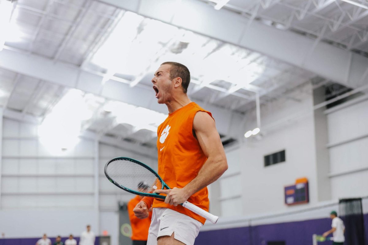 Senior Maxwell Smith gets the crowd pumped up as the Tigers go head-to-head with the Spartans.