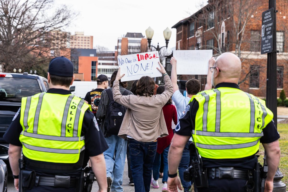 The students held homemade signs sporting various statements.