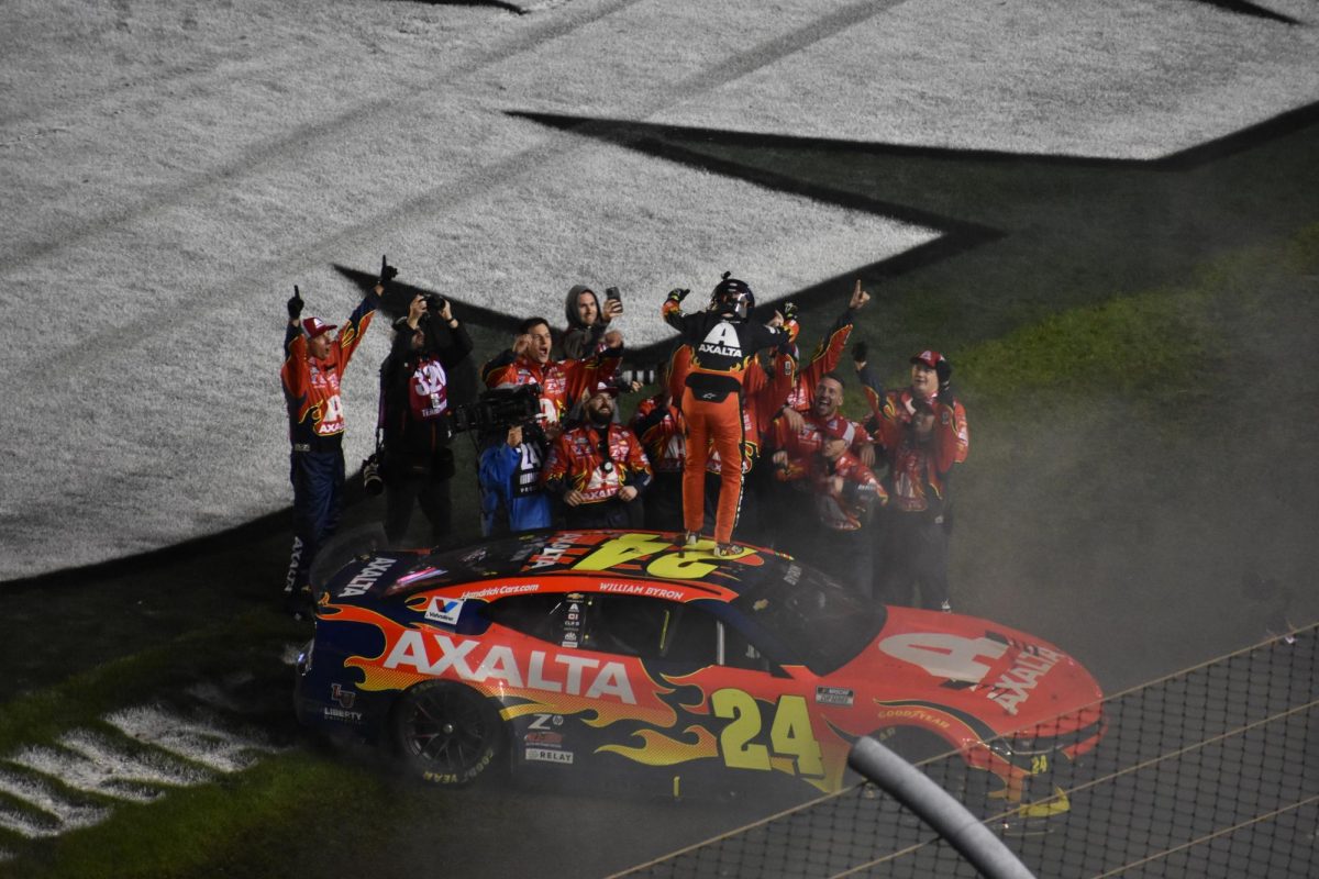 Driver William Byron celebrates with Landon Walker and the rest of the No. 24 team after winning the 2025 Daytona 500.