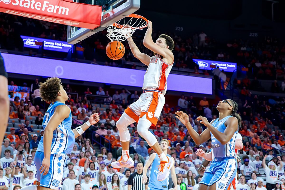 Guard Chase Hunter puts down a dunk in Clemson's win over North Carolina on Feb. 10 at Littlejohn Coliseum. 