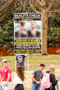 Several of the signs the protestors had contained graphic images.