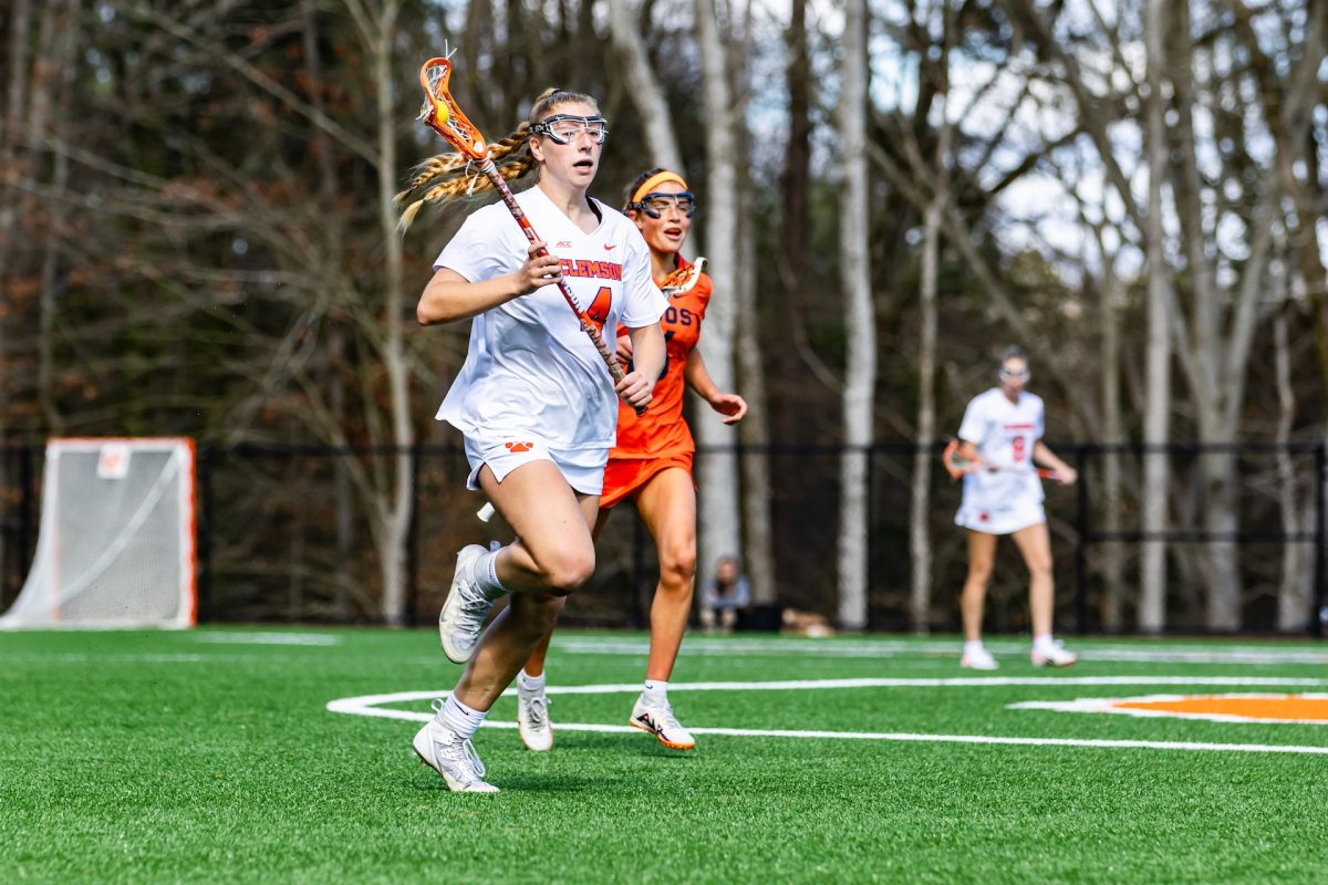 Clemson defender Paris Masaracchia brings the ball down the field in the Tigers' game against Virginia on March 2, 2024. 