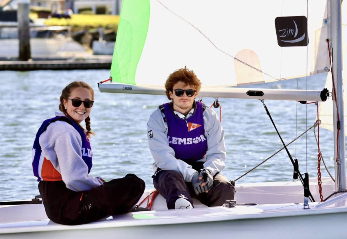 Club Sailing members proudly wear their orange and purple as they complete a race this past February.