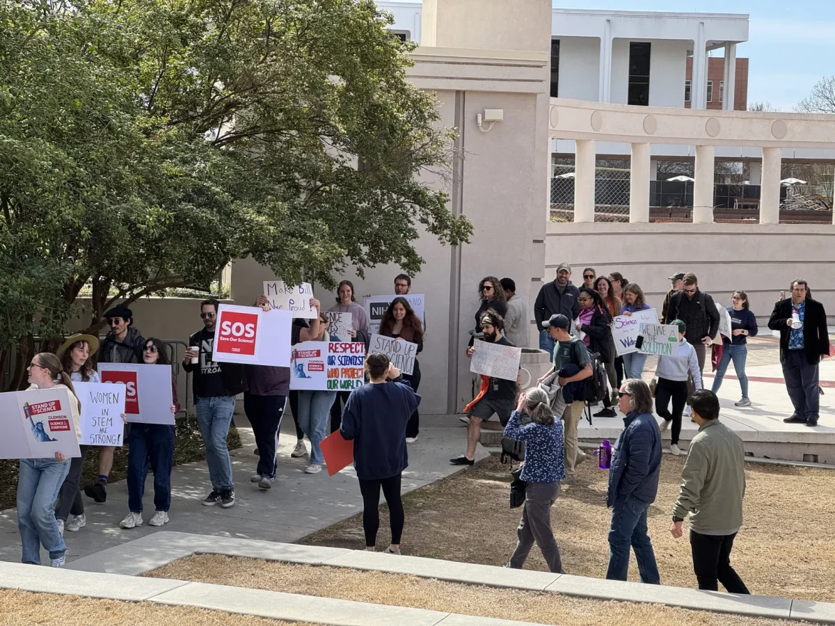 The group consisted of a variety of students, professors and scientists, and many held signs supporting the Stand Up For Science nationwide movement.