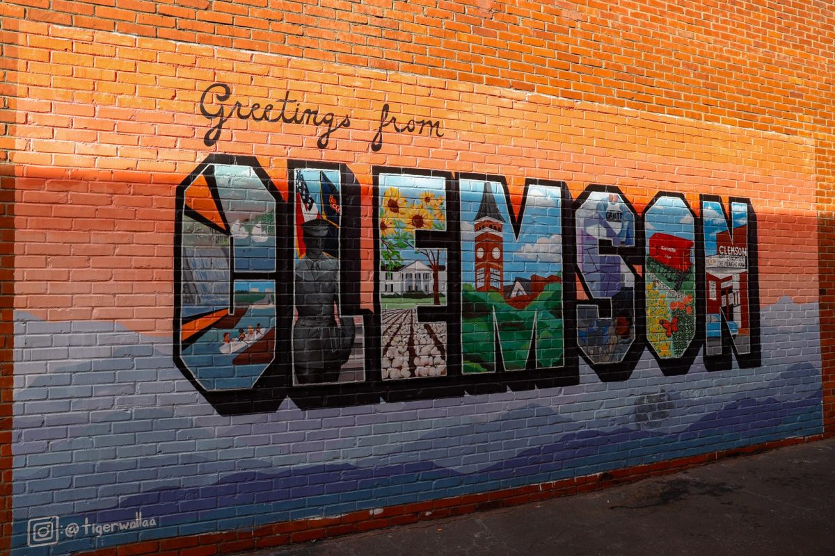 The Greetings from Clemson logo is a downtown staple, located on the side of Tiger Sports Shop.