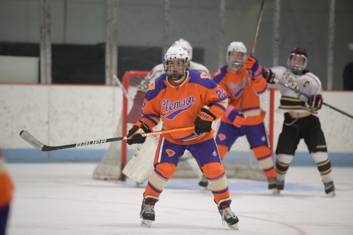 Forward Tommy Papa (22) watches the puck during Clemson's game against Charleston in 2022.