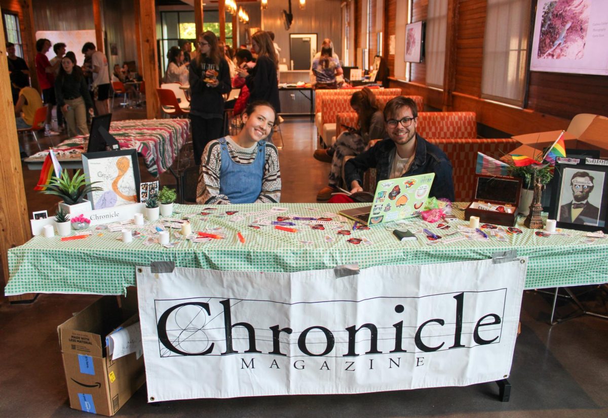 Staff pictured at the welcome table for the Spring 2024 Chronicle Release event.