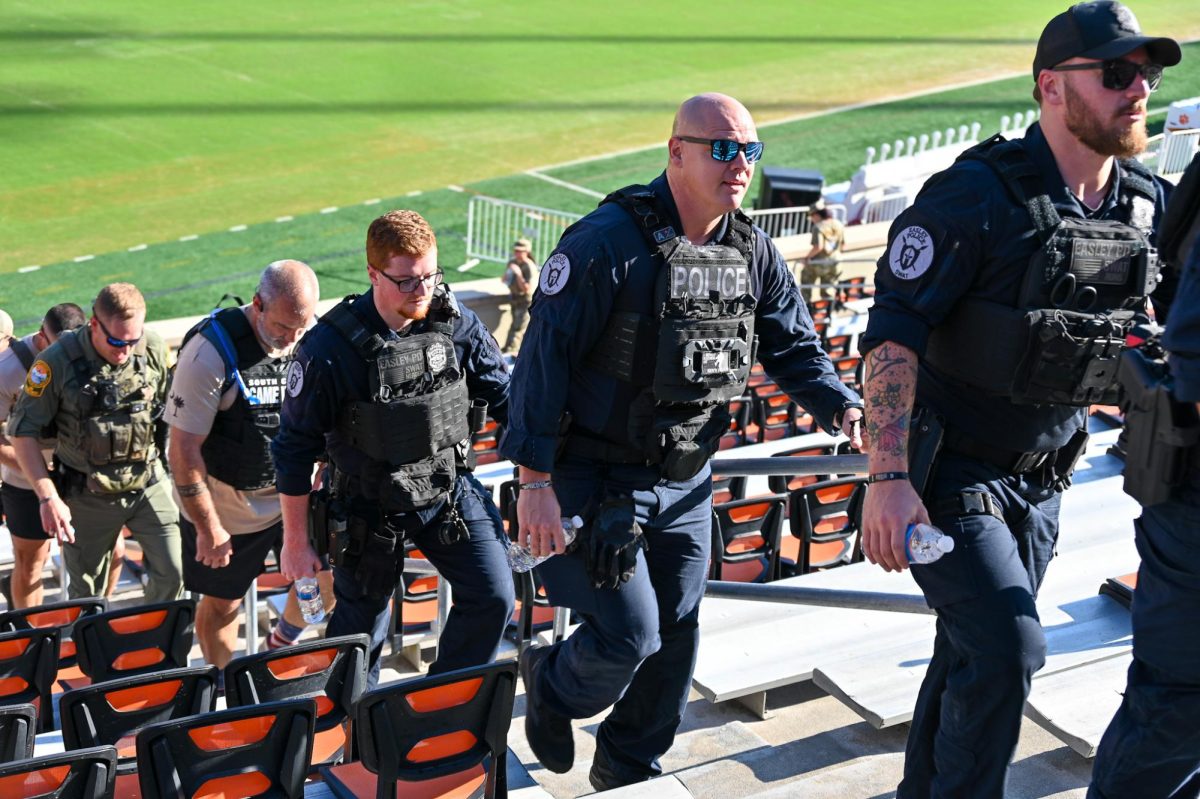 Police officers climb Memorial Stadium's stairs to honor the lives lost on Sept. 11, 2001. 
