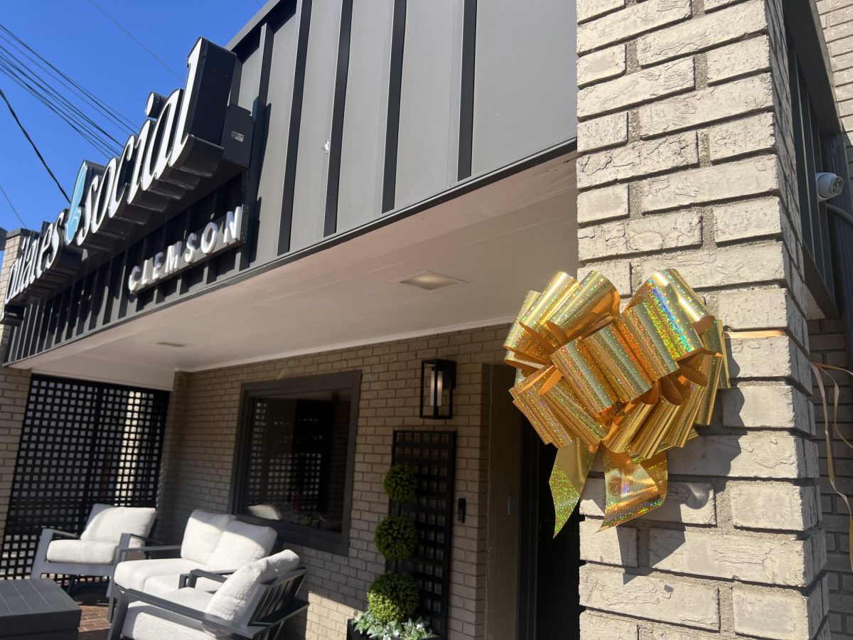 Clemson students, cheerleaders, business owners and residents tied gold ribbons around downtown Clemson for pediatric cancer awareness month.