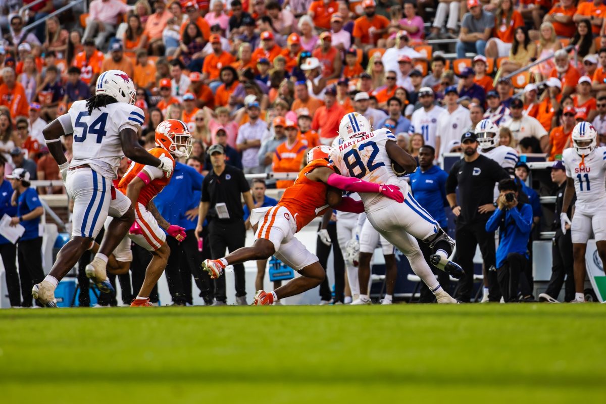 Clemson safety Khalil Barnes, No. 7, makes a tackle on SMU tight end R.J. Maryland in the Tigers' loss to the Mustangs on Oct. 21.