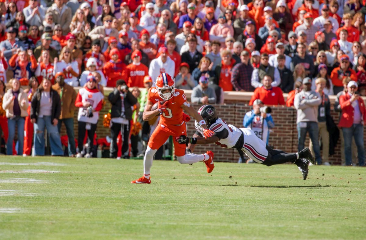 Wide receiver Antonio Williams evades a tackle to earn some yards after a catch against South Carolina in 2024.