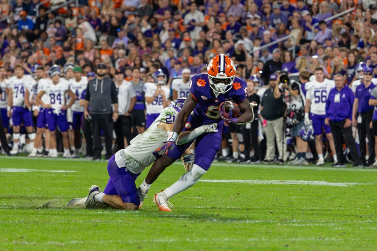 No. 6 Tyler Brown pushes through the Paladins' defense with the ball at Memorial Stadium on Nov. 22.