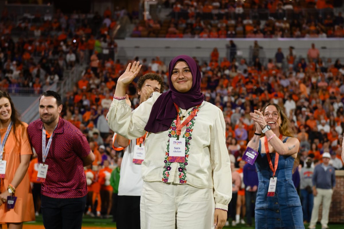 Sara Alkelani waves at the Clemson-FSU game at Memorial Stadium on Saturday, Nov. 8.