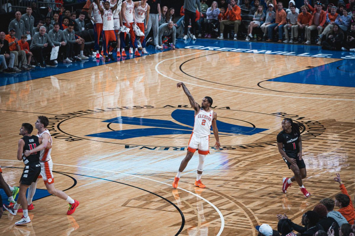 Dillon Hunter watches his 3-pointer hit the net against the Cincinnati Bearcats at Bon Secours Wellness Arena.