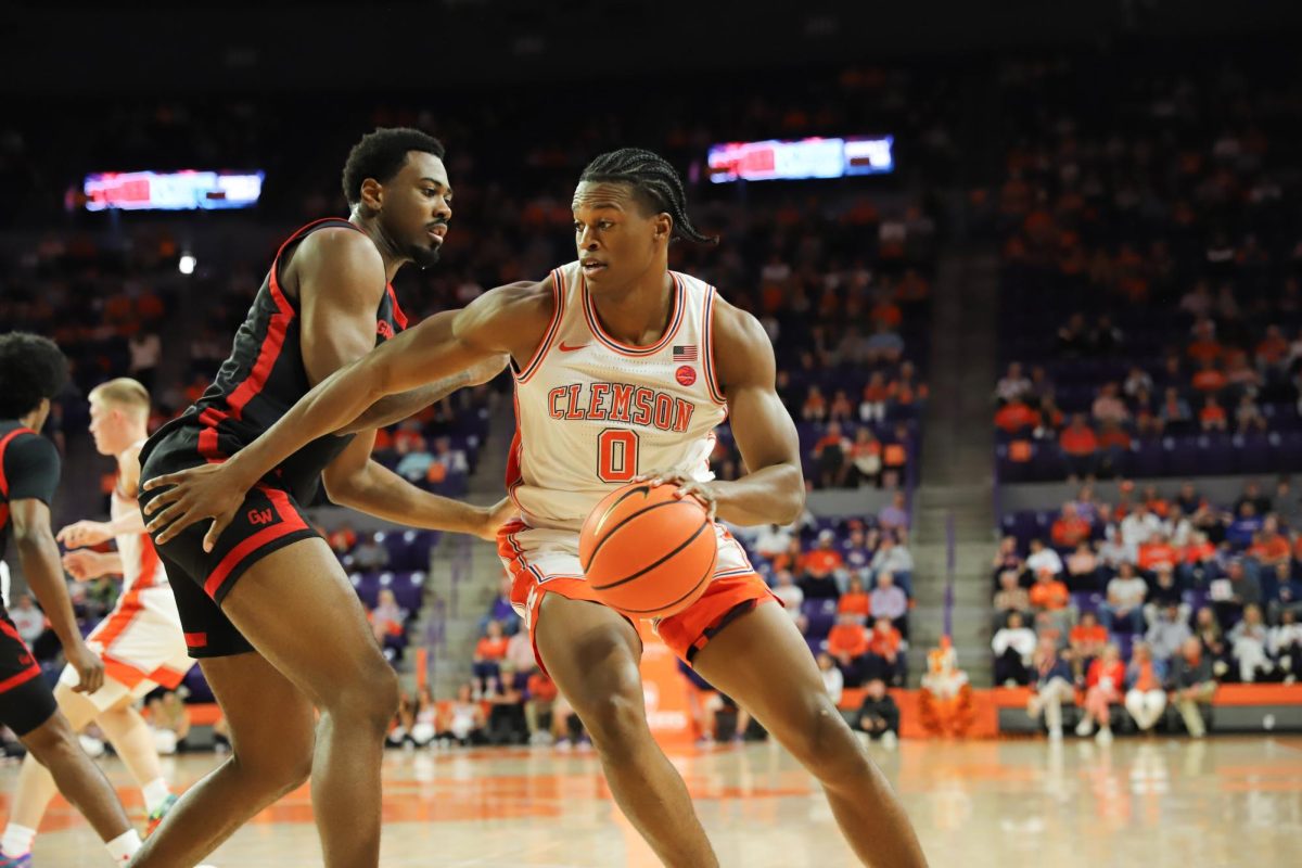 RJ Godfrey drives a smooth move past a Gardner-Webb defender to get to the basket.