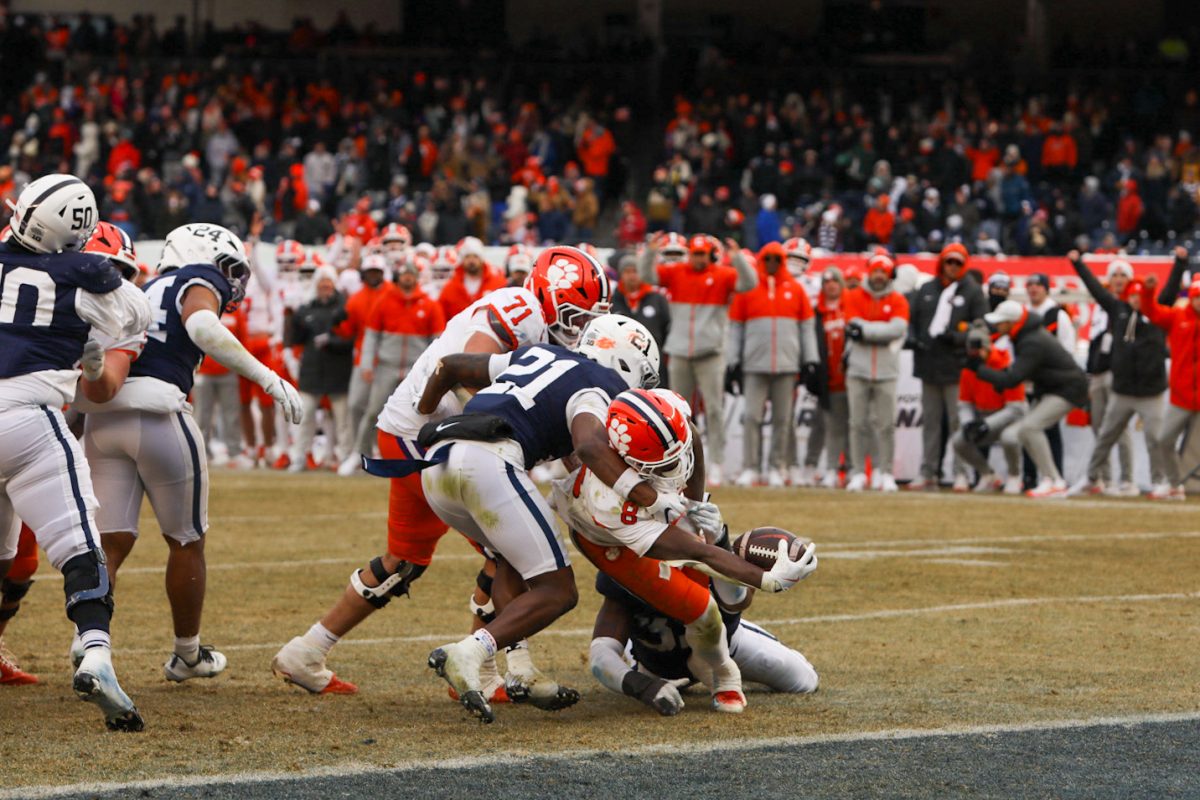 Adam Randall breaks the plane with a fully extended arm to score a touchdown against Penn State at the Pinstripe Bowl.