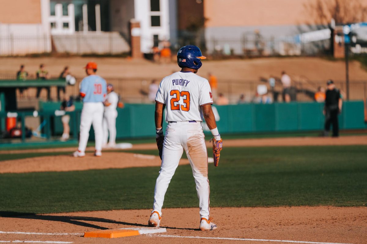 Jarren Purify reaches first base in Clemson's game against Liberty in 2025.