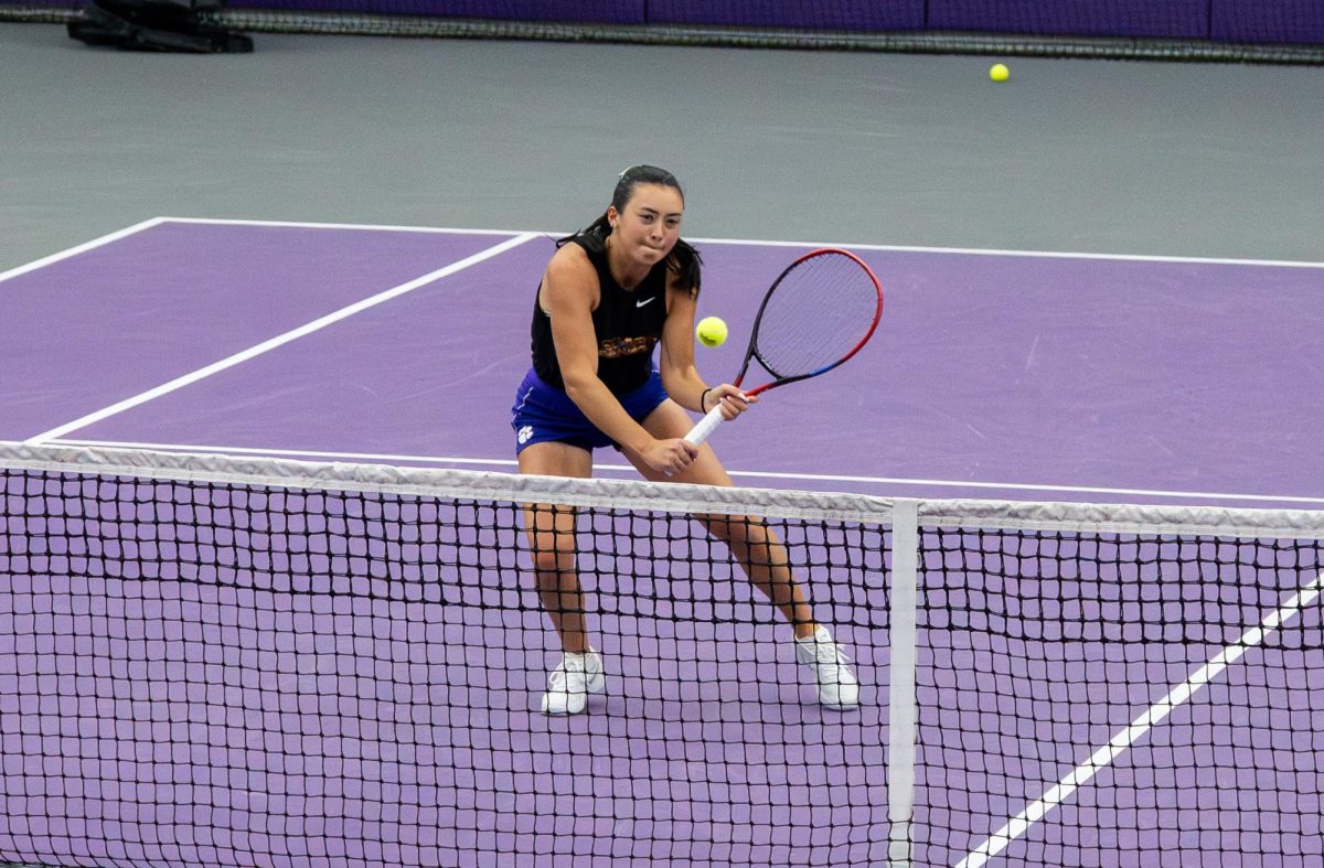 Gaia Parravicini carefully places a backhand volley deep in the court against Kansas during the 2025 season. 