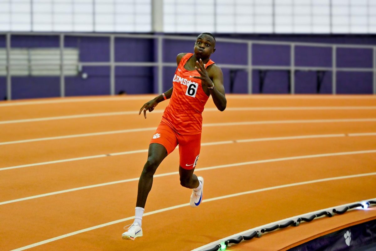 Brian Kweyei rounds the corner at the Clemson Invitational track meet in January 2025.