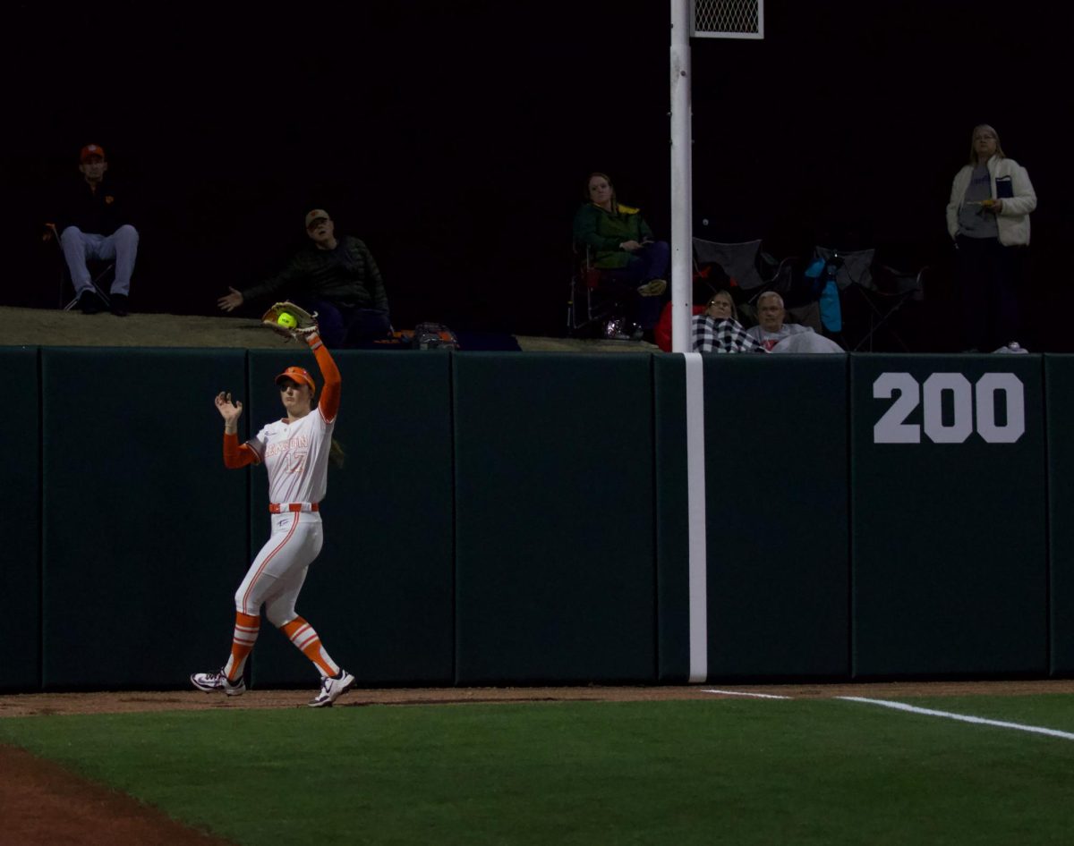 Ava Wilson catches a ball in left field against Furman.