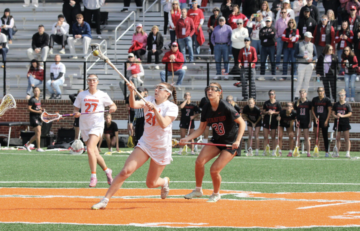 Sophomore defenseman Kira Balis grabs the ball at midfield.