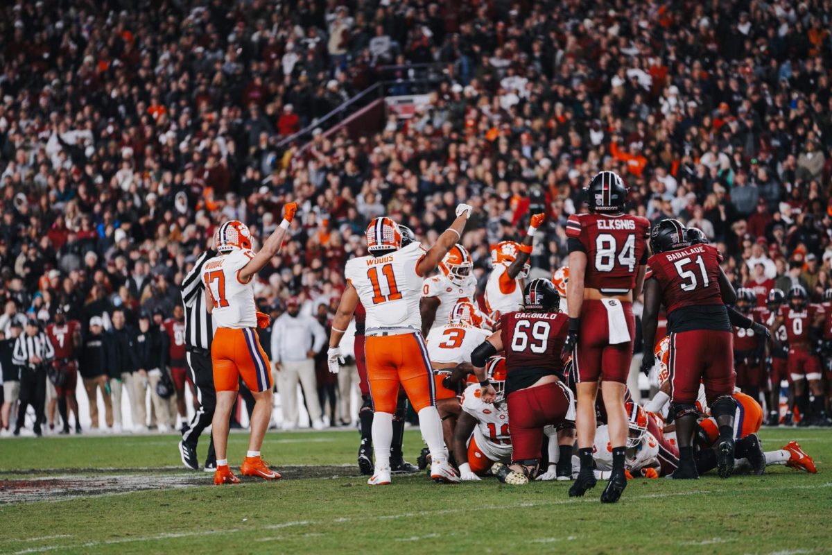 Clemson's defense celebrates a fourth-down stop in a 28-14 win against South Carolina in Williams-Brice Stadium on Nov. 29, 2025.