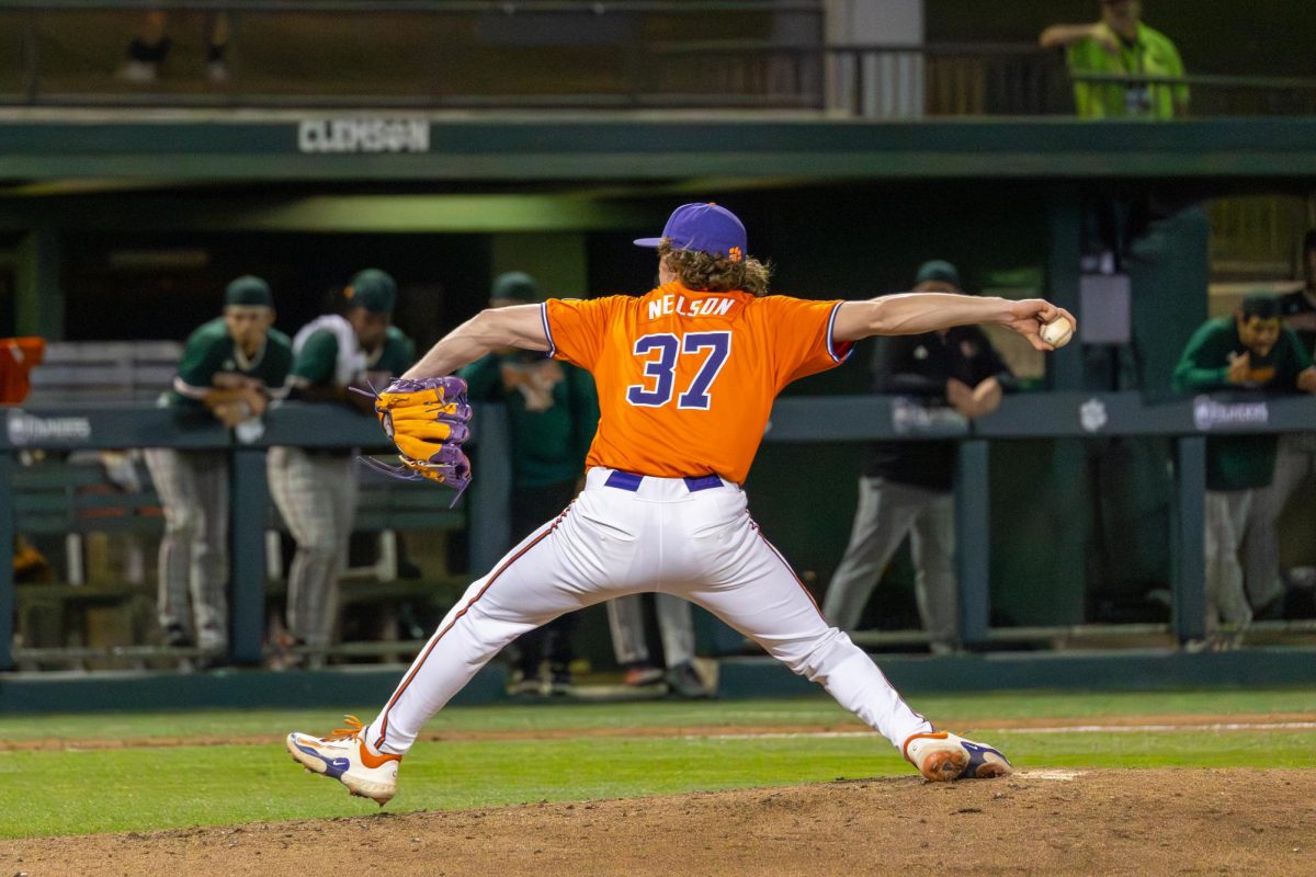 Danny Nelson tosses a pitch in a late-game scenario against Miami on March 27.