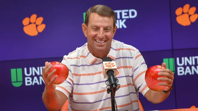 Although admittedly skeptical, football head coach Swabo Dinney is giving the "apple a day" initiative a chance. 