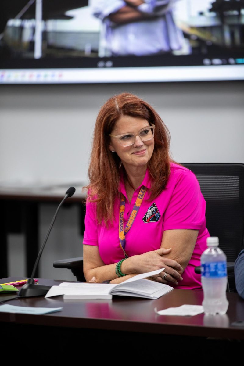 Charlie Blackwell-Thompson wears a Clemson lanyard in a meeting with the Artemis II launch team.