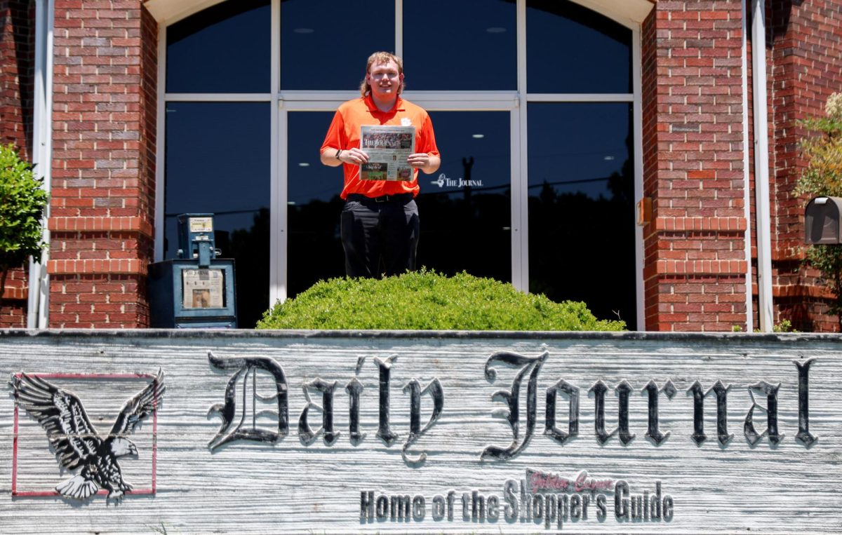 The Tiger's associate editor poses for a picture in front of The Journal, a newspaper published in Seneca, South Carolina, where he is interning this summer.