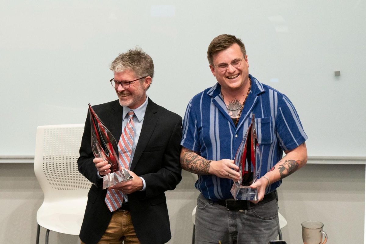 Clemson faculty members Charlie Kurth, left, and Mike Gregory, right, receive the Berkson Courageous Colleague Award.