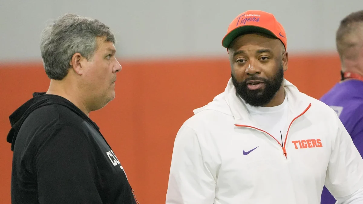 Matt Luke and Tajh Boyd chat during at the Reeves Football Complex in Clemson, South Carolina, on March 4.